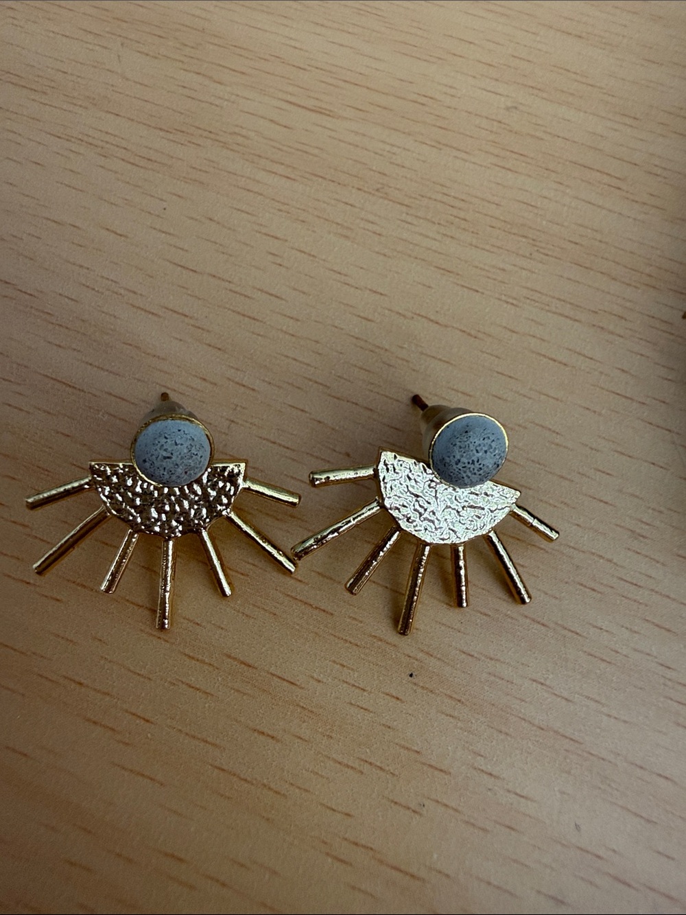 Gold Sunburst Stud Earrings with Grey Stone